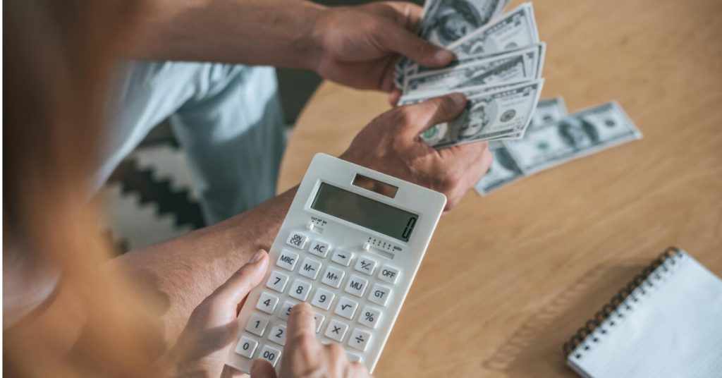 A couple who is calculating their money