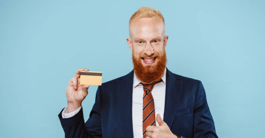 A man holding his new debit card